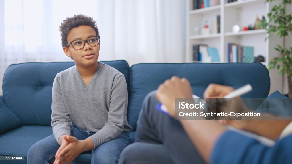 young boy having a talk with an adult